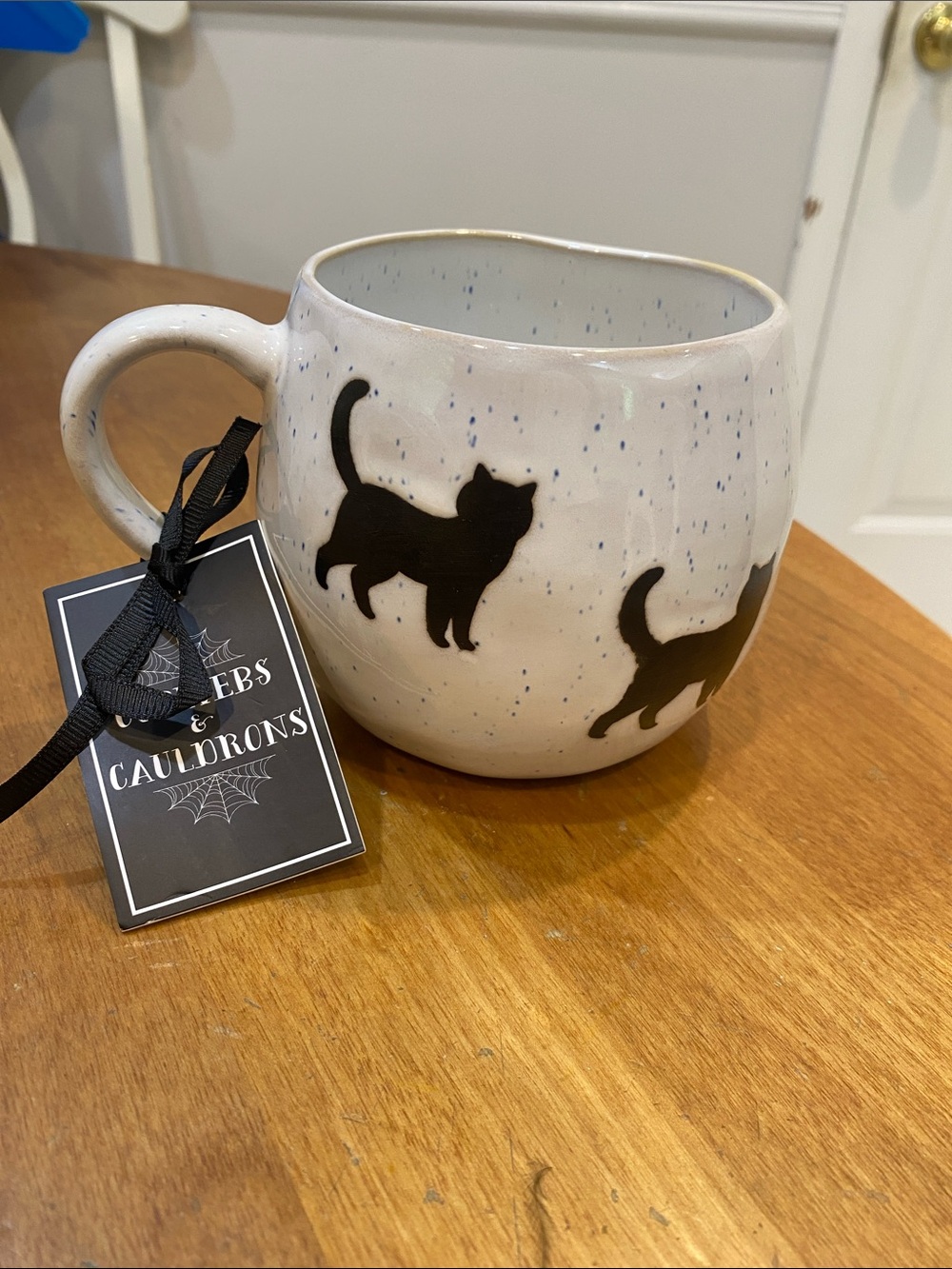 NWT.  Cobwebs & Cauldrons, 24oz., black cat, ceramic mug.